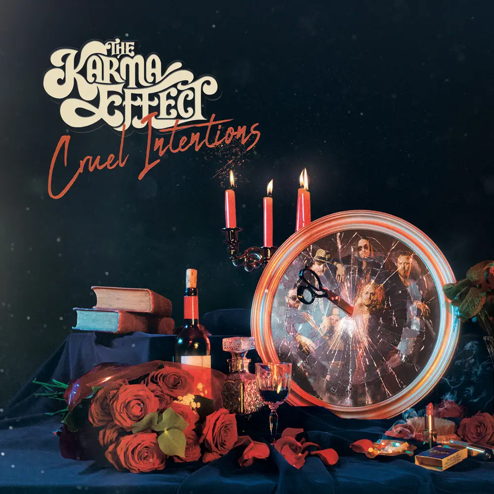 Album cover for The Karma Effect: Cruel Intentions, with a cracked round mirror, roses, candles, wine, and books on a dark table.