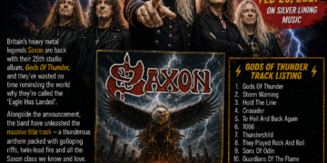 E74a203e-42d9-4f07-9921-605178ce8e99 - the Riff Report Blog Promotional poster for Saxon’s 25th studio album Gods of Thunder. Five band members in black leather pose against a stormy, lightning-filled background; large yellow headline reads 'Gods of Thunder'. Right panel lists tracks; eagle artwork and band logo featured center-bottom.